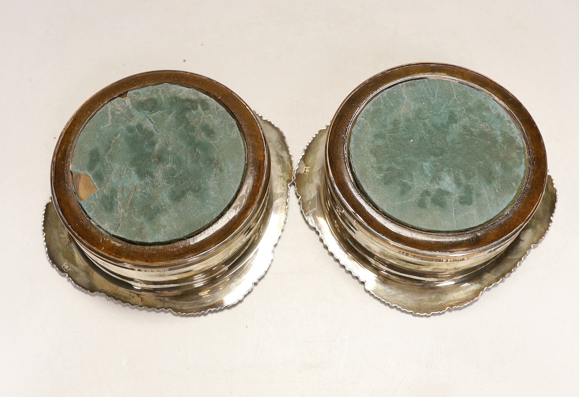 A pair of Victorian silver plated wine coasters, 17cm in diameter